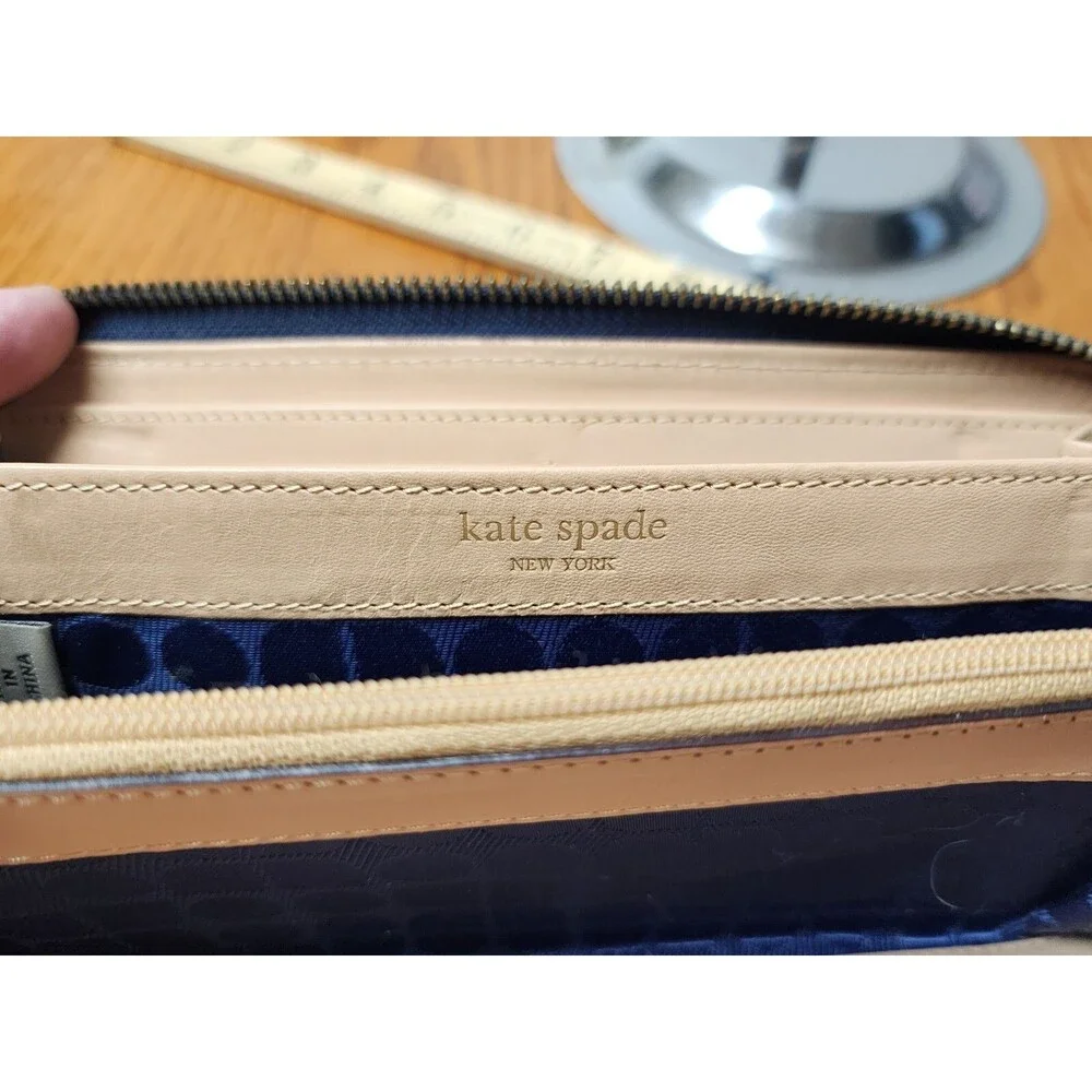 KATE SPADE BLACK WITH WHITE WAVES ZIP AROUND WALLET